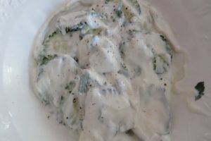 Cucumber slices folded into the Greek yogurt mixture