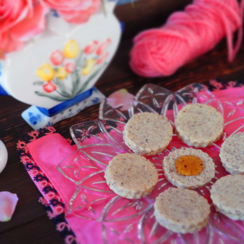 Hazelnut Cookies on a plate with honey