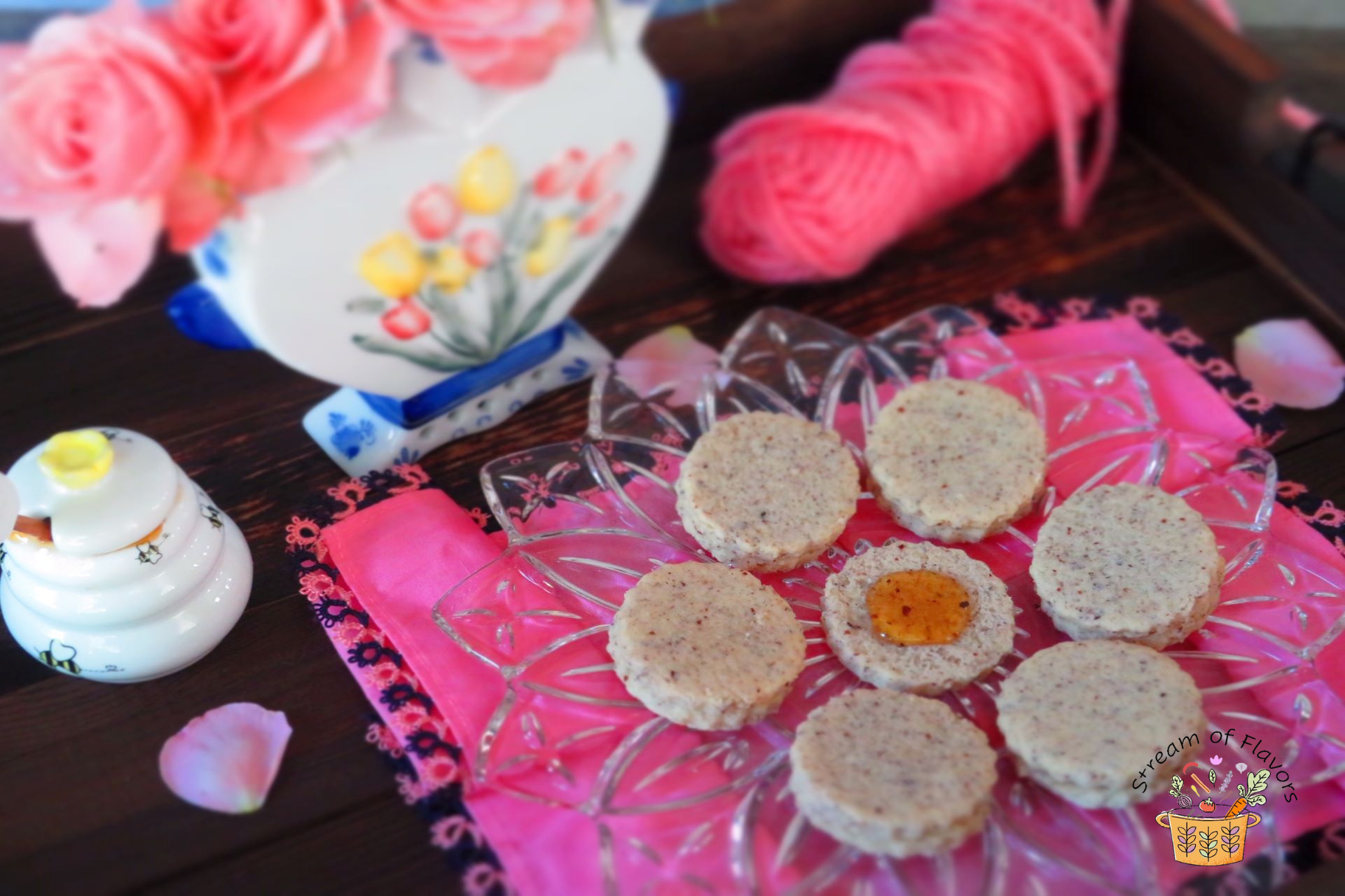 Hazelnut Cookies on a plate with honey
